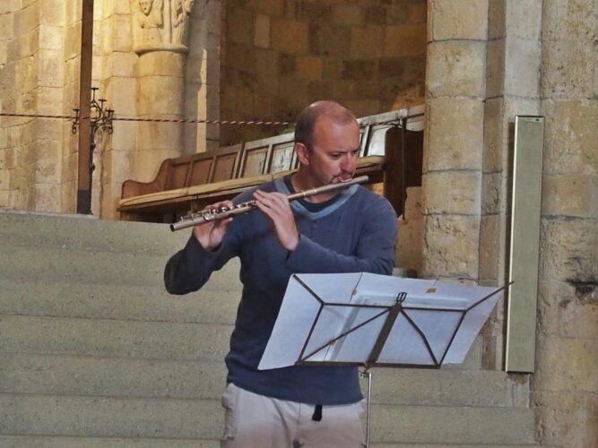 playing flute for guests